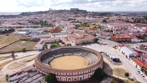 Trujillo,-Caceres,-Extremadura,-Spain---Aerial-Drone-View-of-the-Bullfighting-Arena,-Cityscape-and-Old-Fortress-Castle
