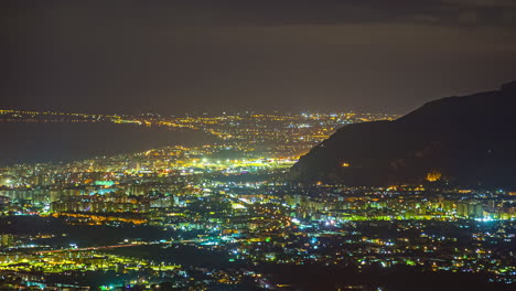 High-angle-shot-of-Palermo-downtown-in-at-nigh-time-with-beautiful-night-lights-in-Sicily,-Italy-in-timelapse
