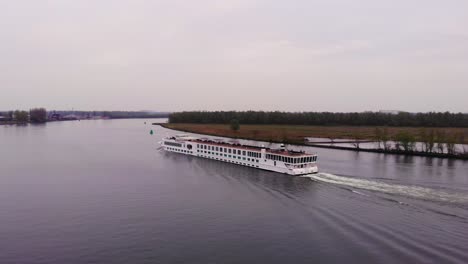 River-Princess-Cruise-Ship-Going-Past-Along-Oude-Maas-On-Cloudy-Day