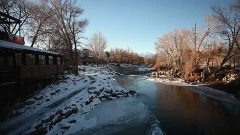 Colorado-Arkansas-River-with-snow-covered-banks-and-the-Rockies-in-the-background,-static