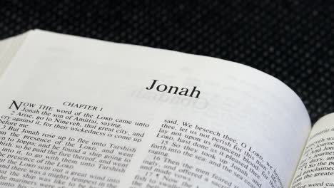 Close-Up-Shot-of-Bible-Page-Turning-to-the-book-of-Jonah