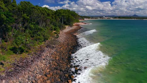 Foamy-Waves-Splashing-On-Rocky-Shore-At-Noosa-National-Park,-Queensland,-Australia---aerial-drone-shot