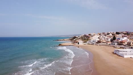 the-stunning-beach-of-cava-d'aliga-in-sicily,-drone-soaring-high,-sunny