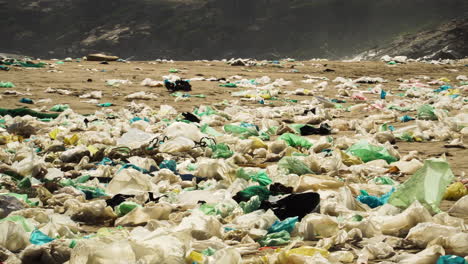Close-up-of-a-very-polluted-beach-in-a-big-wave-of-rubbish