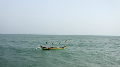 Boat-with-flag-on-sea