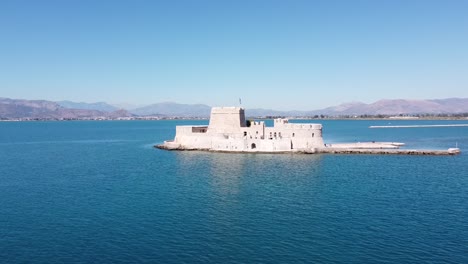 Bourtzi-Fortress-at-Small-Island-in-Nafplio,-Peloponnese,-Greece---Aerial-Forward