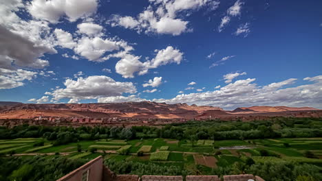 Cumulus-clouds-float-over-fertile-valley-in-Morocco,-Africa