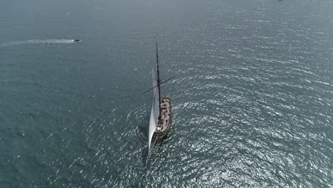 Drone-footage-of-Le-Renard,-corsair-boat-in-the-sea,-Saint-Malo,-Bretagne,-France
