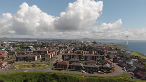 Panoramic-view-over-Buckhaven-on-the-Fife-coast-Scotland-with-massive-wind-generator-in-the-energy-park