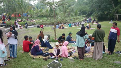 Yogyakarta,-Indonesia---May-26,-2022-:-Asian-people-picnicking-around-the-river-with-fresh-view
