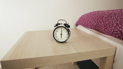 Alarm-Clock-Standing-in-Bedroom-on-the-Table