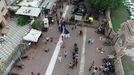 Aerial-shot-of-people-walking-inside-the-temple