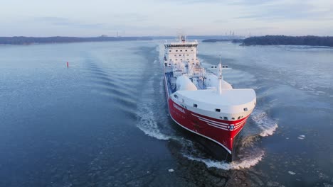 LNG-powered-chemical-and-oil-product-tanker-RAMANDA,-SGRY,-making-way-ahead-in-Finnish-archipelago-during-hazy-winter-morning