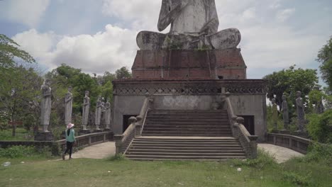 Pan-up-to-giant-Buddha-statue-at-the-temple-of-Wat-Ek-Phnom-near-the-city-of-Battambang-in-Cambodia