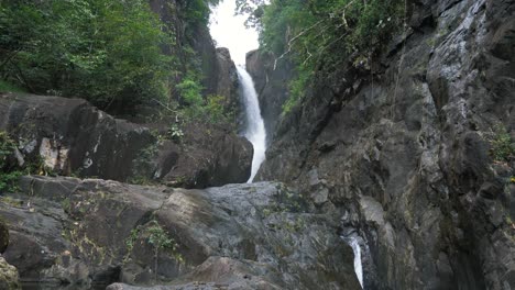 Waterfall-in-a-rainforest,-Thailand.-4K