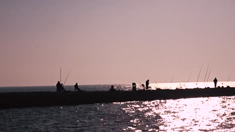 Group-of-fisherman-standing-on-the-bay