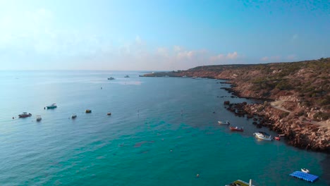Rising-aerial-drone-shot-over-the-coast-of-Konnos-Bay