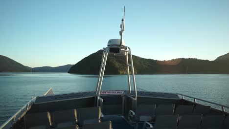 Morning-sunrise-boat-cruise-in-Marlborough-Sounds,-New-Zealand