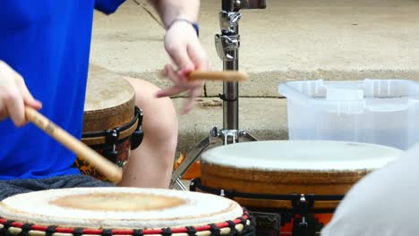 A-drummer-plays-two-drums-with-sticks-alternating-from-drum-to-drum