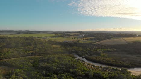 Aerial-shot-of-the-morning-sunlight-on-screw-creek-on-the-Victorian-coastline-in-Australia