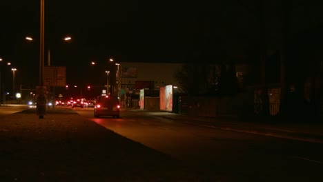 Timelapse-of-a-busy-road-at-night-time-in-east-Berlin-suburb,-Germany