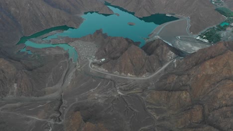 Aerial-view-of-a-lake-surrounded-by-endless-mountains