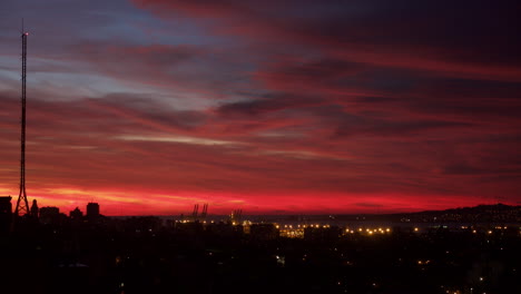 Time-lapse-of-red-clouds-and-radio-tower-in-Montevideo-Uruguay