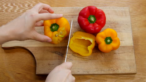 Person-chopping-bell-peppers