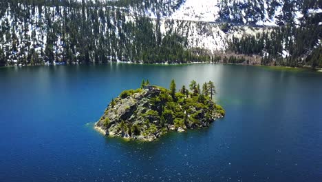 Aerial-drone,-Lake-Tahoe-at-Emerald-Bay,-snow-mountains,-sunny-day,-Nevada,-USA