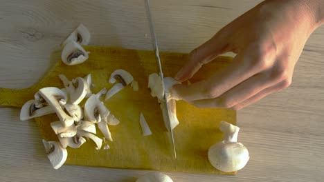 Woman-cutting-mushrooms-in-slow-motion