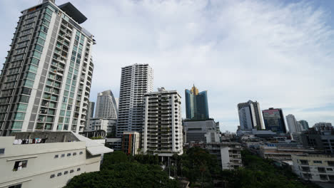Bangkok-Thailand---Circa-Timelapse-on-Cloudy-Day-with-Some-Blue-Sky-Towers-and-Buildings-and-People-on-Pedestrian-Area
