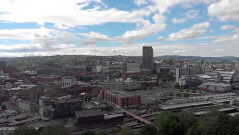 Drone-flying-above-Sheffield-City-Summer-Sunny-Day-4K-Train-Station-Sheffield-Hallam-Vivid-Traffic-and-Trains-travelling-backwards-from-the-city