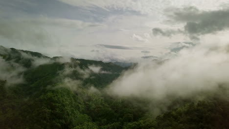 Aerial-view-flying-above-lush-green-tropical-rain-forest-mountain-with-rain-cloud-cover-during-the-rainy-season-on-the-Doi-Phuka-Mountain-reserved-national-park-the-northern-Thailand