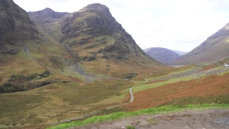 Glen-Coe-old-road-with-hikers-in-soft-autumn-light