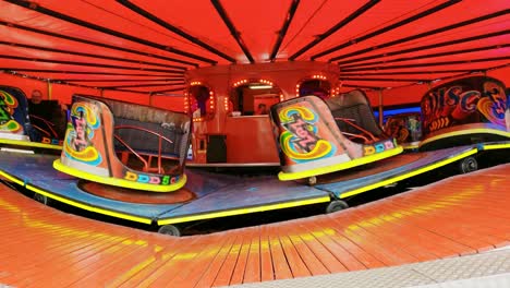 Waltzers-ride-at-the-funfair-with-all-the-colorful-lights-at-a-fair-ground-attraction