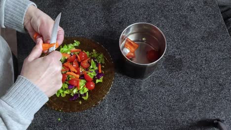 Timelapse-of-a-white-woman-cooking-a-salad-in-a-marmol-table