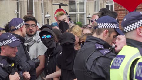 Antifa-gather-outside-the-BBC-studio-to-protest-Tommy-Robinson-in-London,-UK