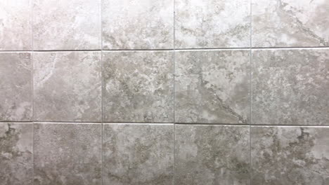 Square-tiles-inside-bathroom-on-wall-or-floor