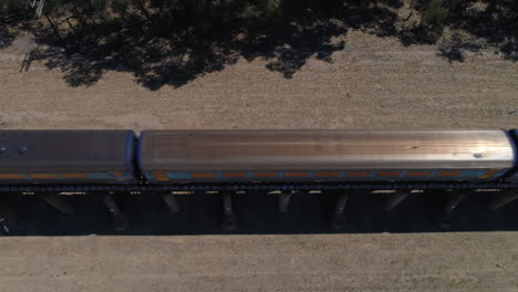 Aerial-top-down-of-the-XPT-passenger-train-passing-through-rural-Australia