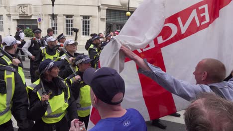 Tommy-Robinson-supporters-wave-flags-outside-the-BBC-studio-in-London