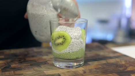 kiwi-matcha-chia-pudding-with-white-coconut-chia-pudding,-healthy-food-being-prepared-by-chef