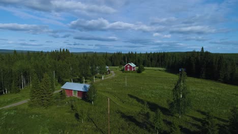 Droneshot-of-a-idyllic-swedish-small-village-surrounded-by-a-vast-forest