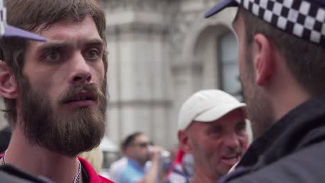Tommy-Robinson-supporter-argue-with-police-along-Whitehall,-London