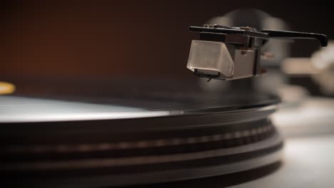 Dropping-Stylus-Needle-On-Vinyl-Record-Playing-With-Disc-Rotating-Close-Up