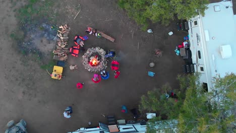 Aerial-view-moves-in-on-Campers-around-fire