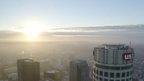 Gorgeous-aerial-fly-over-US-Bank-helipad-in-downtown-Los-Angeles-during-sunrise