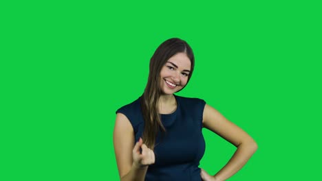 Girl-call-camera-with-one-finger-in-front-of-a-green-screen