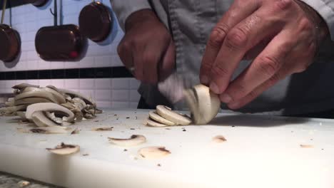 Closeup-footage-of-cook-cutting-mushrooms