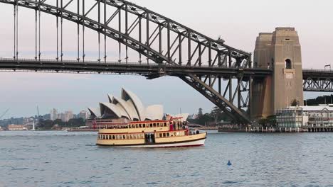 View-of-Sydney-Harbor-Bridge-and-Sydney-Opera-House-in-Perfect-late-afternoon-light-with-boating-traffic-on-the-water
