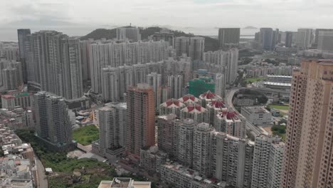 Aerial-drone-shot-of-Taipa-highrise-apartment-buildings-on-cloudy-day